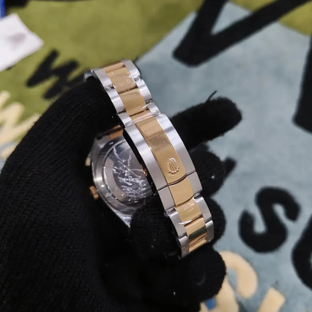 Thumb Sky-Dweller Stainless Steel / Yellow Gold / Black