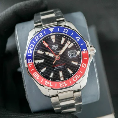 Aquaracer 300M Calibre 7 GMT Stainless Steel / Black / Bracelet