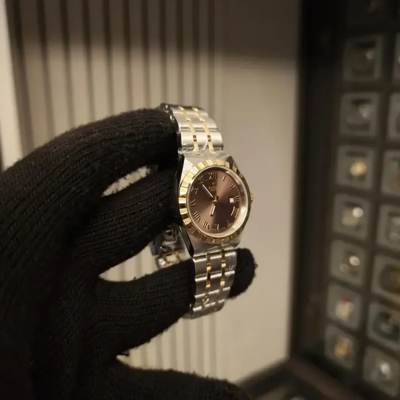 Thumb Royal Date 28 Stainless Steel / Yellow Gold / Chocolate - Roman